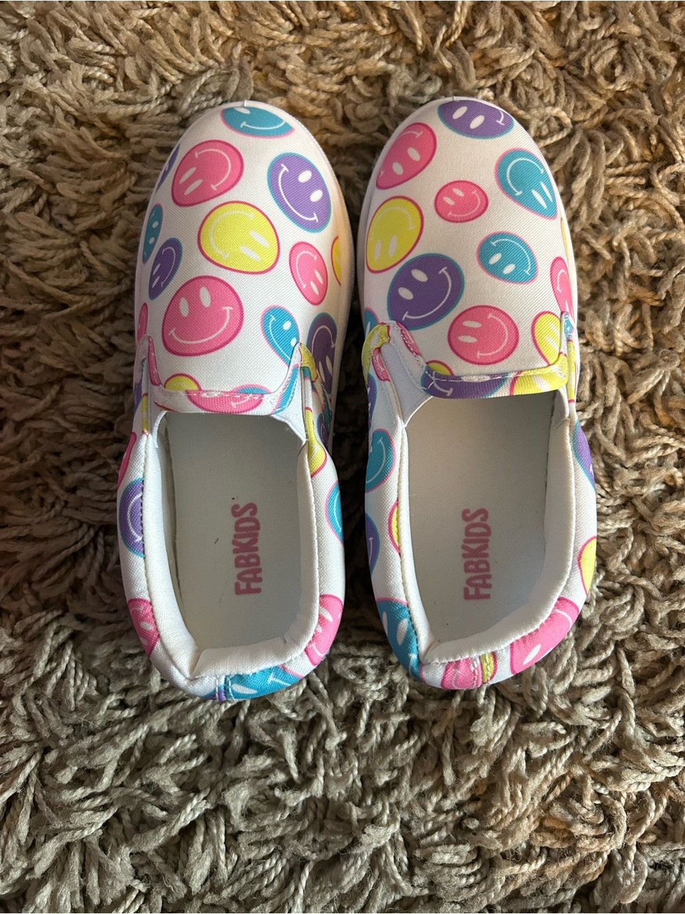 fabkids White Slip-On Sneakers with Pink, Purple, Blue, and Yellow Smiley Print